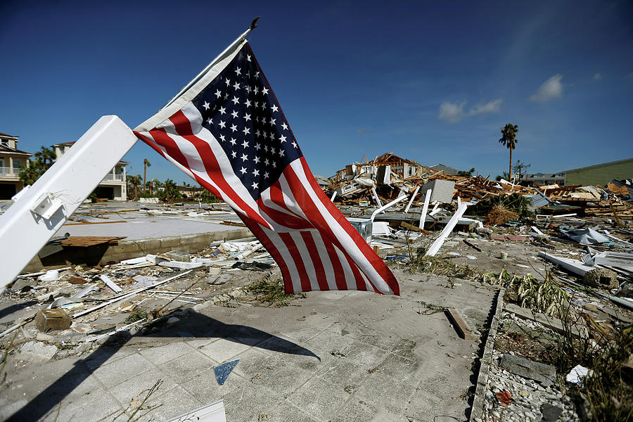 An American Flag Flies Amongst Rubble Photograph by Jonathan Bachman ...