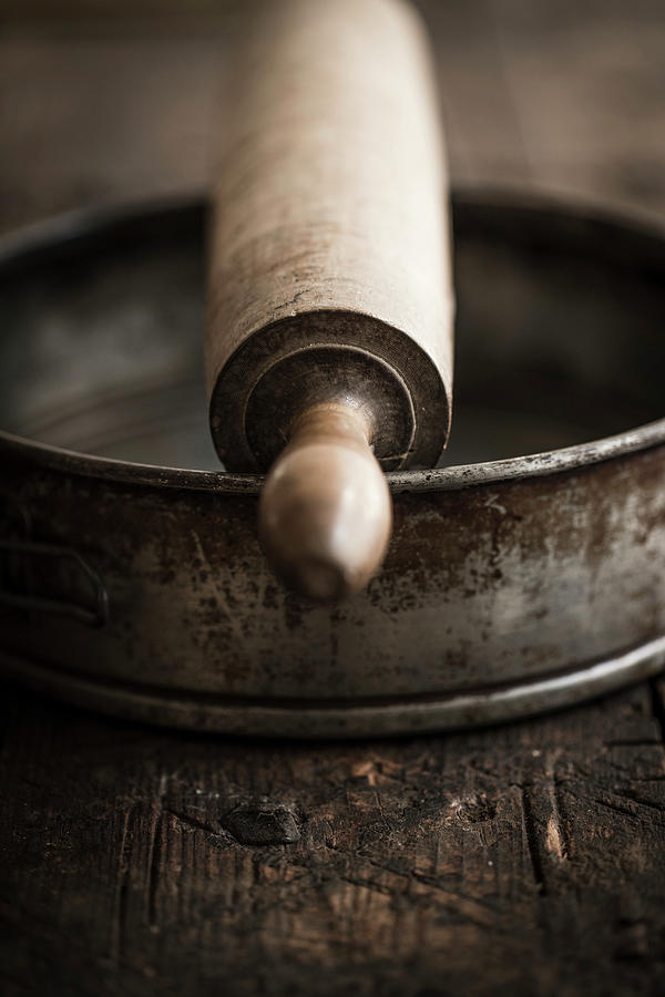 An Antique Cake Tine And A Rolling Pin Photograph by Eising Studio