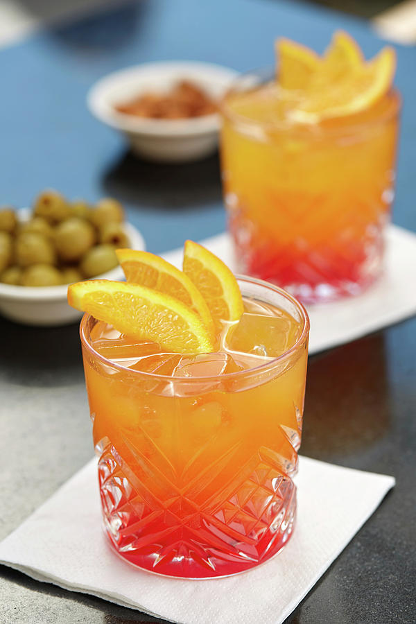 An Aperitif With Campari Soda, Olives And Almonds Photograph by Herbert Lehmann