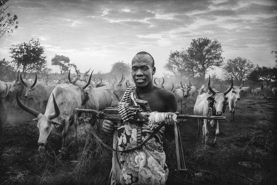 An Armed Man Of The Mundari Tribe Photograph by Svetlin Yosifov - Pixels