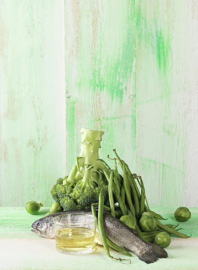An Arrangement Featuring Trout, Green Vegetables And Oil lipids Photograph by Armin Zogbaum