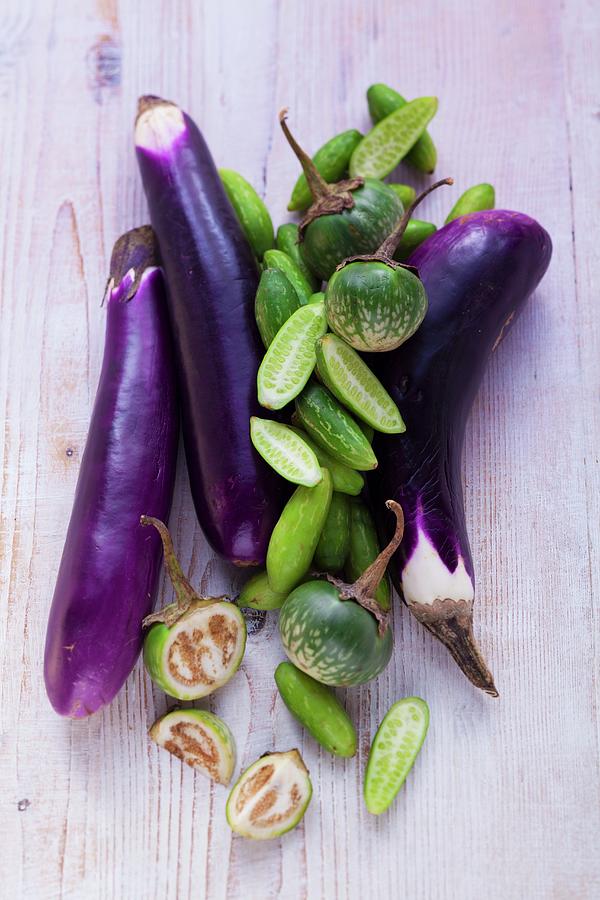 An Arrangement Of Aubergines And Cucumbers Photograph by Eising Studio - Food Photo & Video