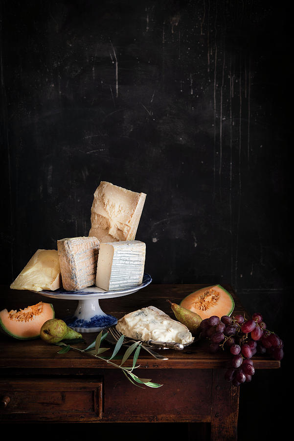 An Arrangement Of Cheese With Melon, Pears And Grapes Photograph by Justina Ramanauskiene
