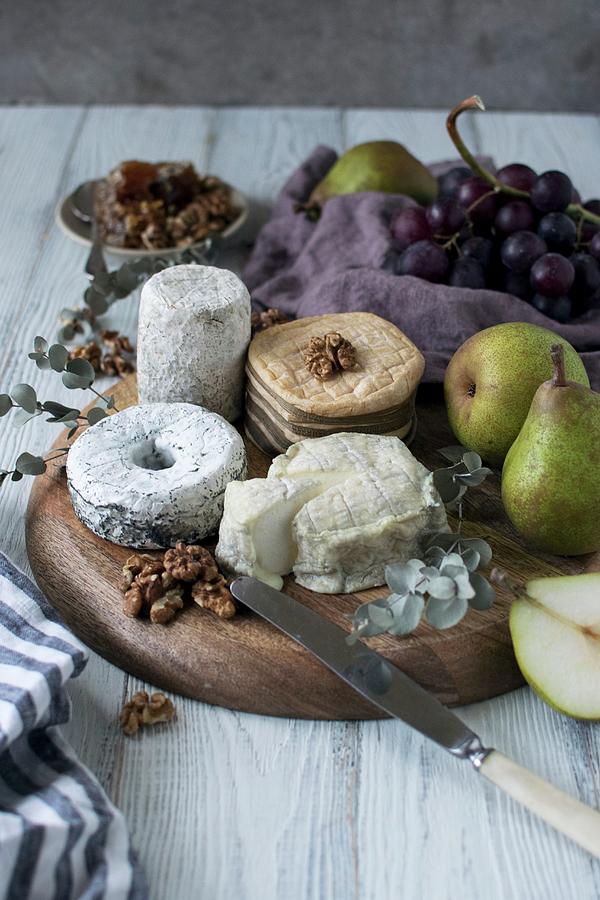 An Arrangement Of Cheese With Pears And Nuts Photograph by Justina Ramanauskiene