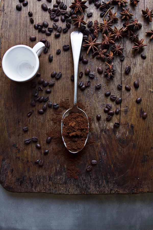 An Arrangement Of Coffee Beans, Coffee Powder And Star Anise Photograph by Marie Sjoberg