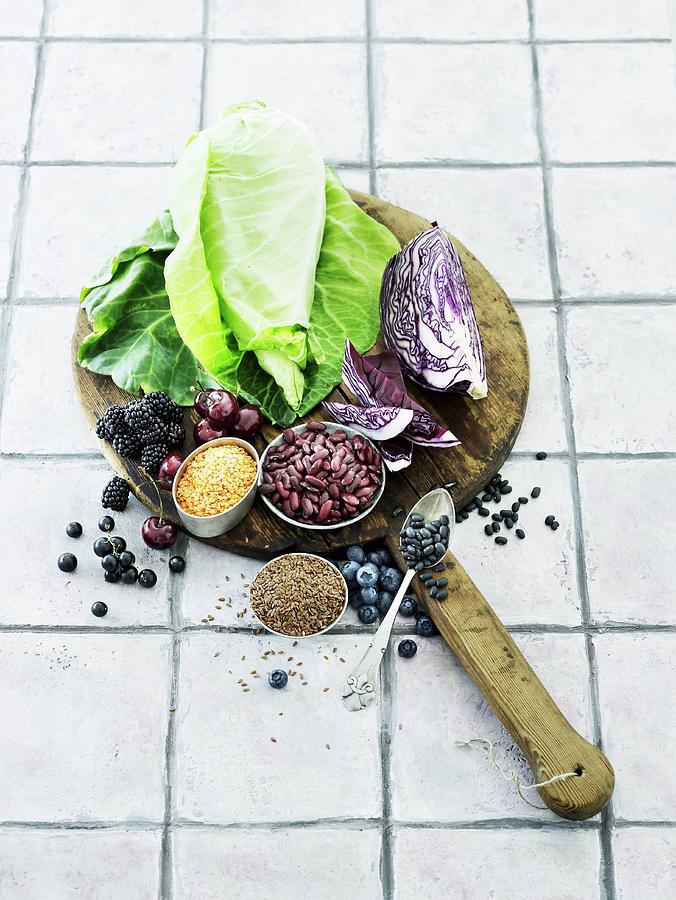 An Arrangement Of Different Types Of Cabbages, Legumes And Berries Photograph by Mikkel Adsbl