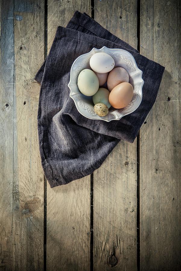 An Arrangement Of Eggs With A Quails Egg Photograph by Imagerie