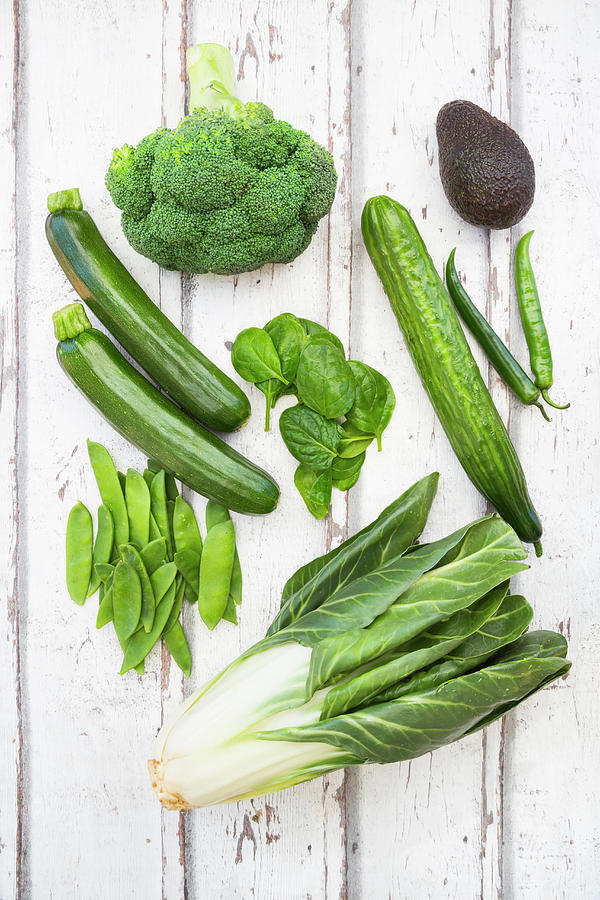 An Arrangement Of Green Fruit And Vegetables: Broccoli, Avocado, Mange Tout, Chard, Courgette, Baby Spinach And Green Chilli Peppers Photograph by Larissa Veronesi