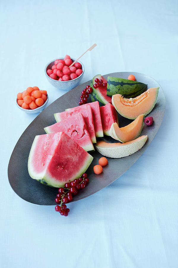 An Arrangement Of Melon With Watermelon, Cantaloup Melon, Melon Balls And Redcurrants Photograph by Rafael Pranschke