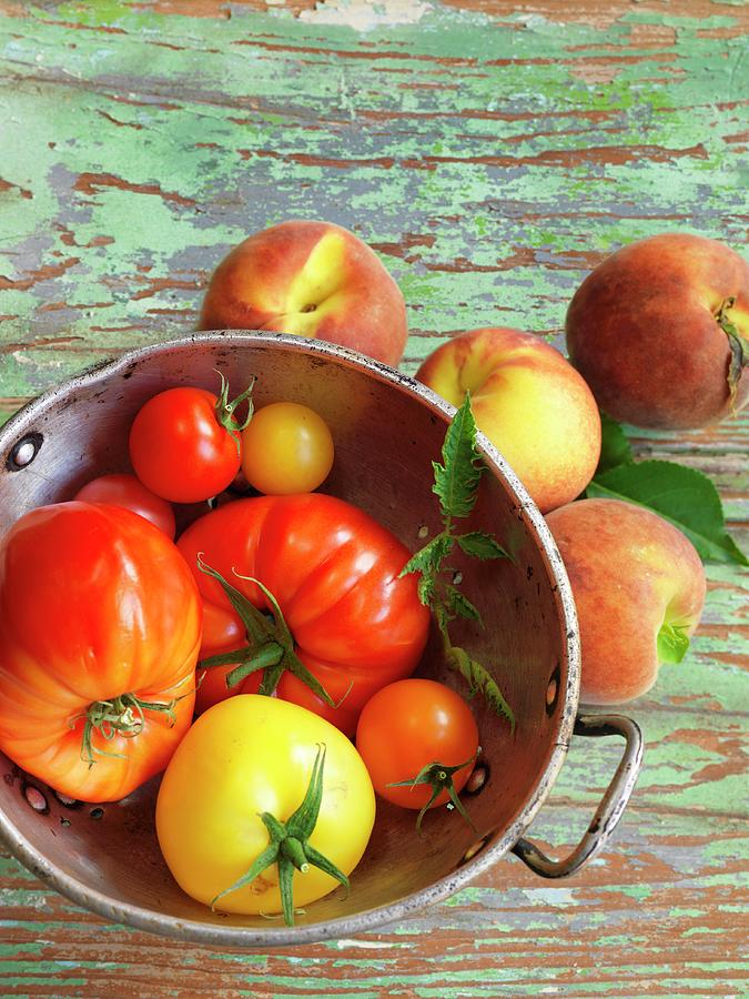 An Arrangement Of Peaches And Tomatoes Photograph by Jim Scherer
