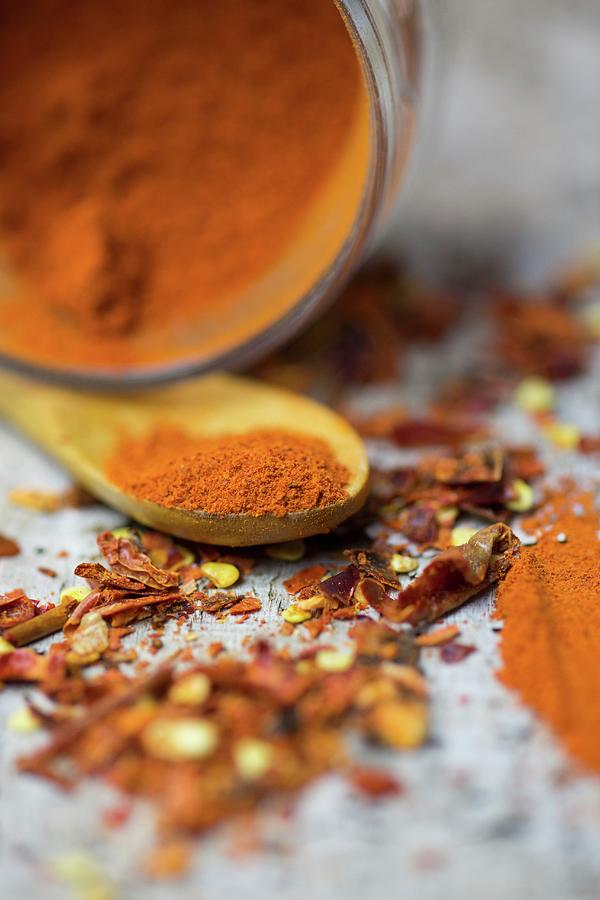 An Arrangement Of Spices With Chilli Powder And Chilli Flakes Photograph by Riccardobruni