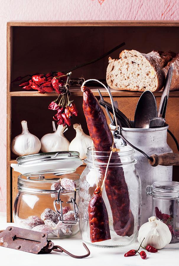 An Arrangement Of Various Smoked Sausages In Storage Jars Photograph by Natasha Breen