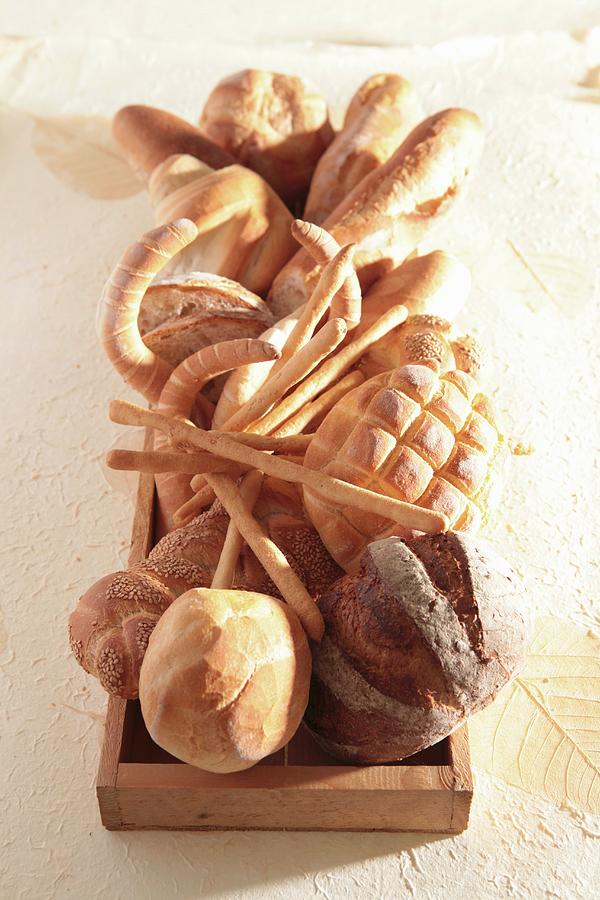 An Arrangement Of Various Types Of Bread Photograph by Francine Reculez