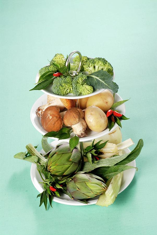 An Arrangement Of Vegetables And Mushrooms On A Cake Stand Photograph by Franco Pizzochero