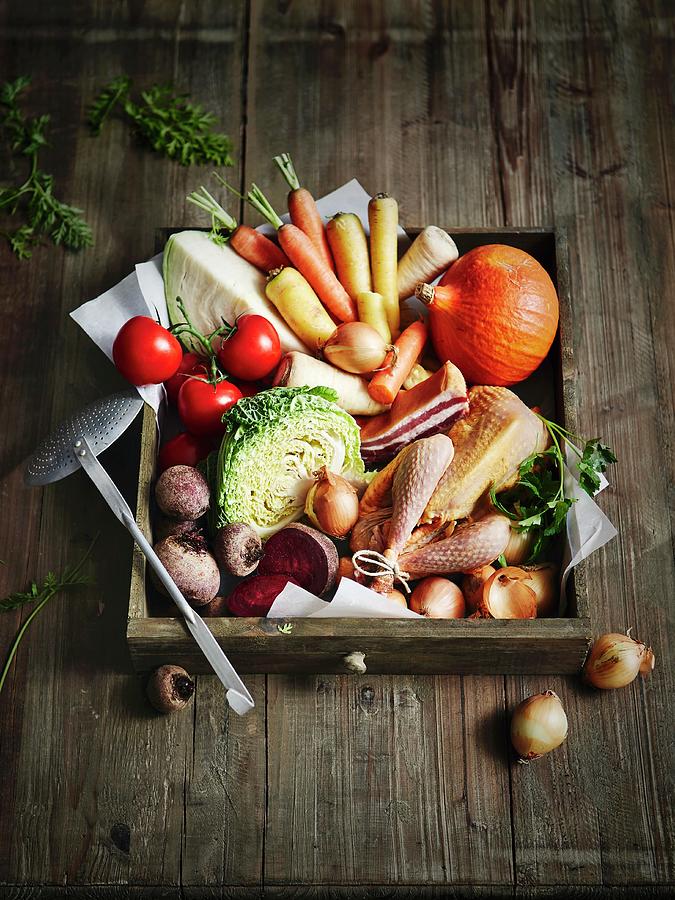 An Arrangement Of Vegetables With Chicken ingredients For Stew Photograph by Thorsten Kleine Holthaus
