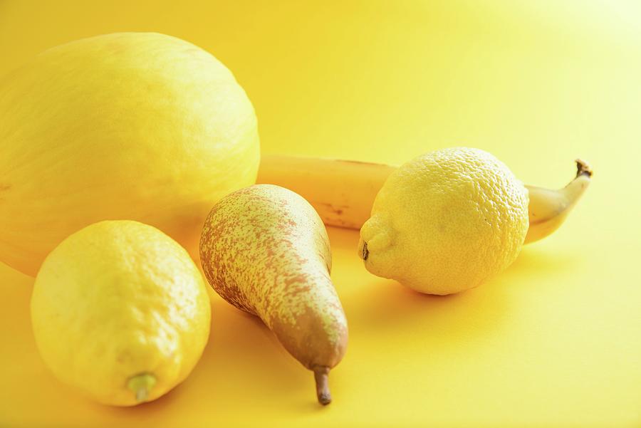 An Arrangement Of Yellow Fruits On A Yellow Surface Photograph by Katrin Benary