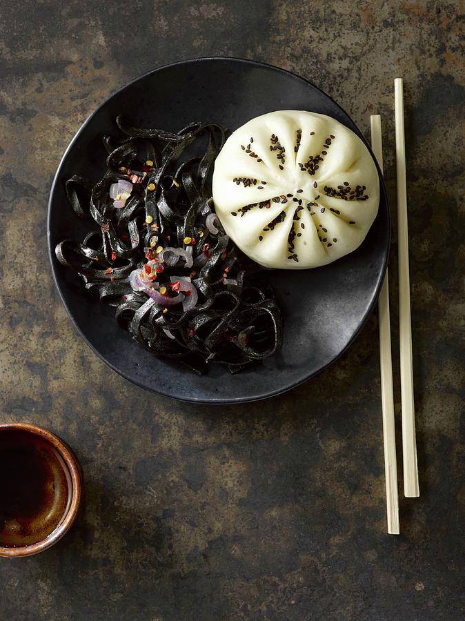 An Asian Bao Bun And Squid Ink Noodles asia Photograph by Laurie Proffitt