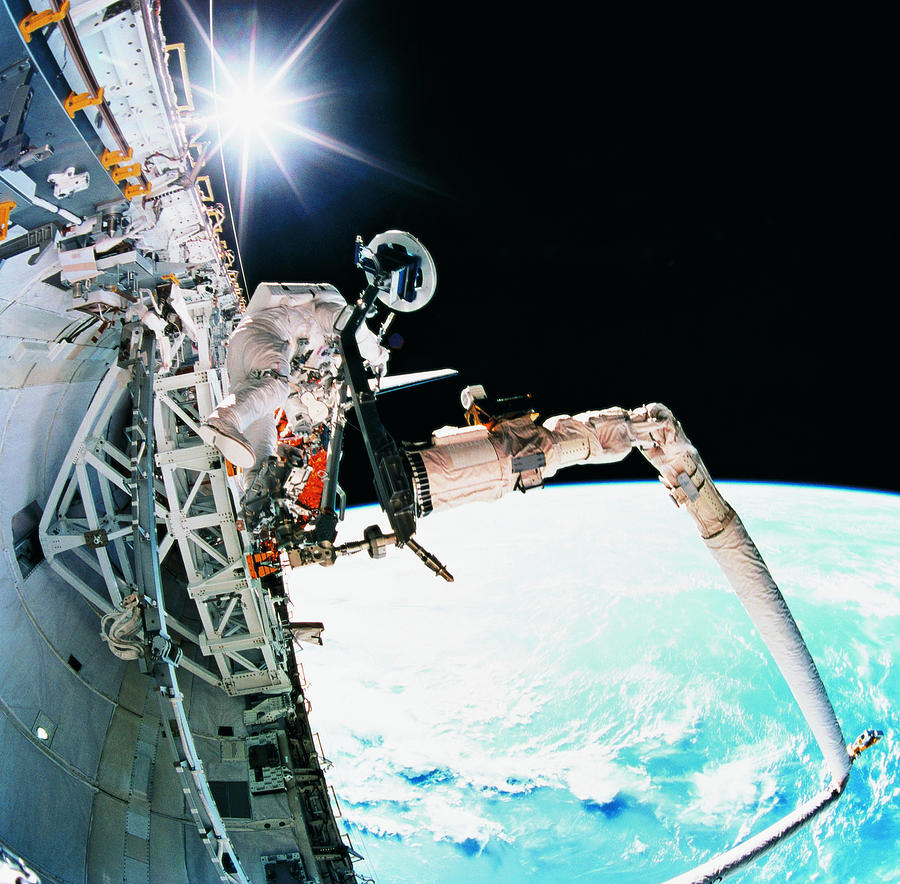 An Astronaut Working In Space Photograph by Stockbyte