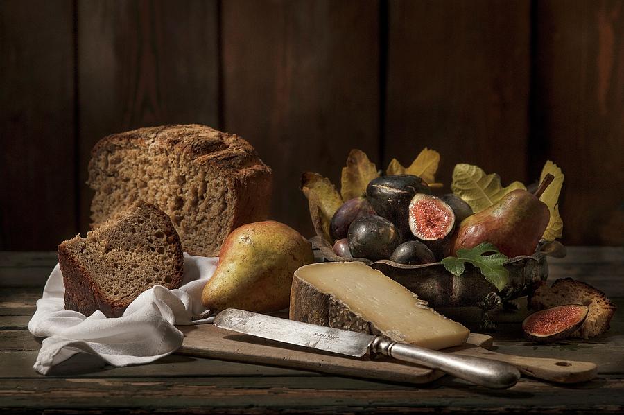 An Autumnal Arrangement Featuring Bread, Cheese, Pears And Figs Photograph by Piga & Catalano S.n.c.