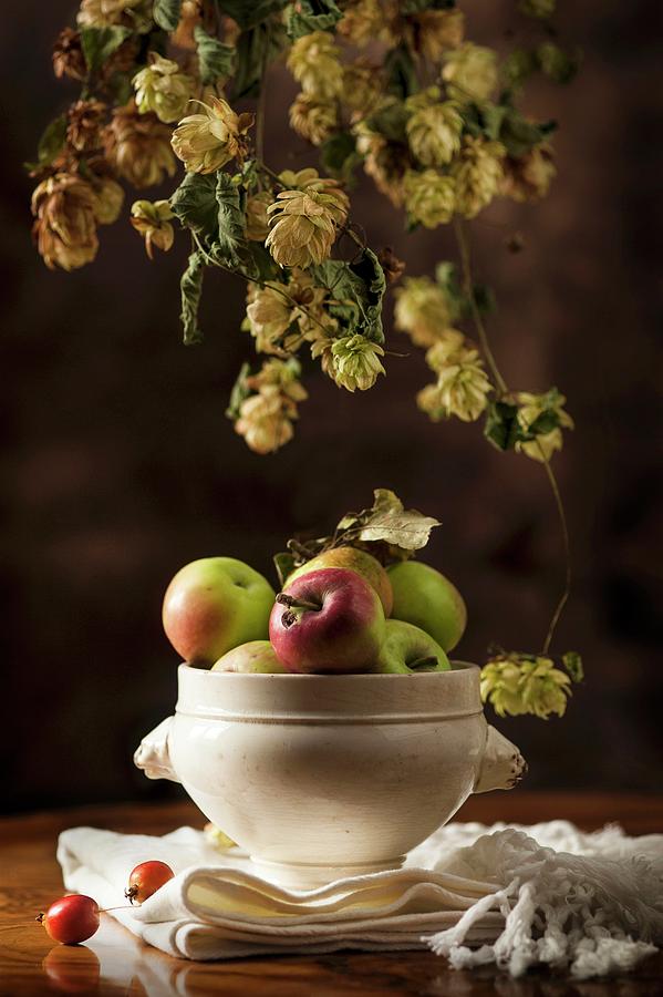 An Autumnal Arrangement Featuring Hops And Apples Photograph by Piga & Catalano S.n.c.