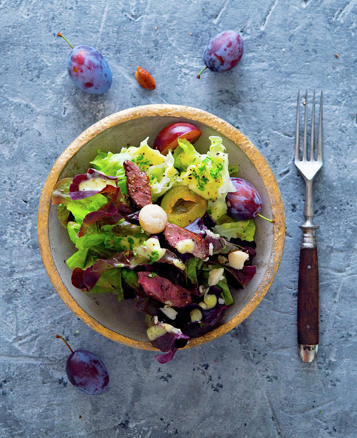 An Autumnal Salad With Damsons, Beef Fillet And Macadamia Nuts Photograph by Udo Einenkel