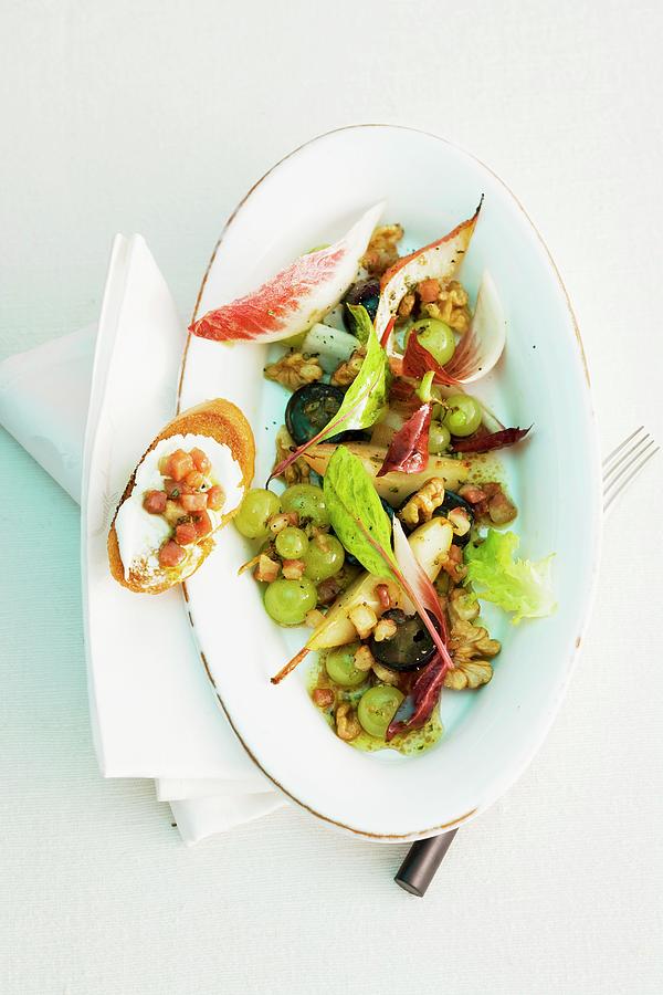 An Autumnal Salad With Grapes And Walnuts Photograph by Michael Wissing