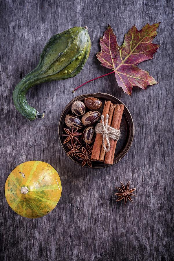 An Autumnal Still Life With Pumpkins, Spices And A Laurel Leaf top View Photograph by Nitin Kapoor
