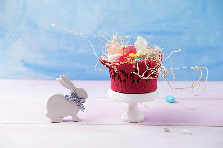 An Easter Basket With Jelly Egg Sweets, Sugar-coated Eggs And Foam Eggs Photograph by Mandy Reschke