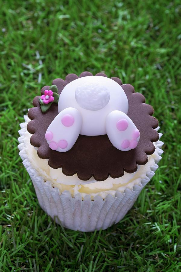 An Easter Bunny Cupcake On A Grass Surface Photograph by Adrian Britton