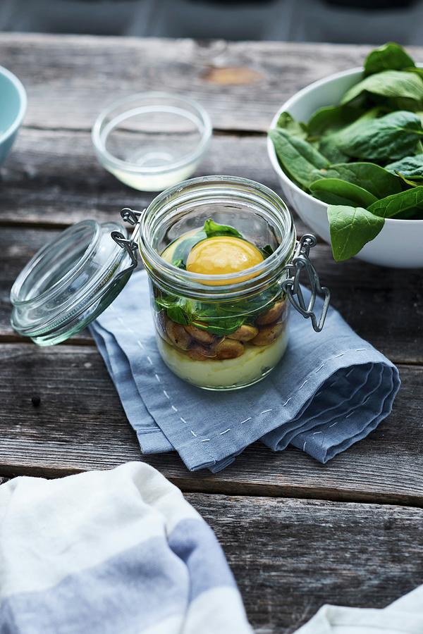 An Egg In A Glass: Layered Ingredients In A Flip-top Glass Jar Photograph by Rodion Kovenkin