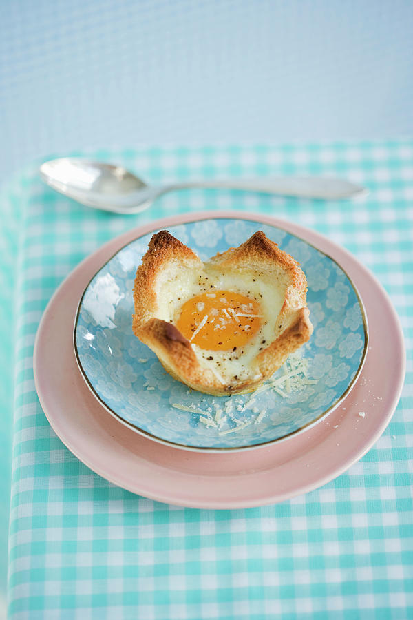 An Egg In A Toast Bowl For Breakfast Photograph by Colin Cooke