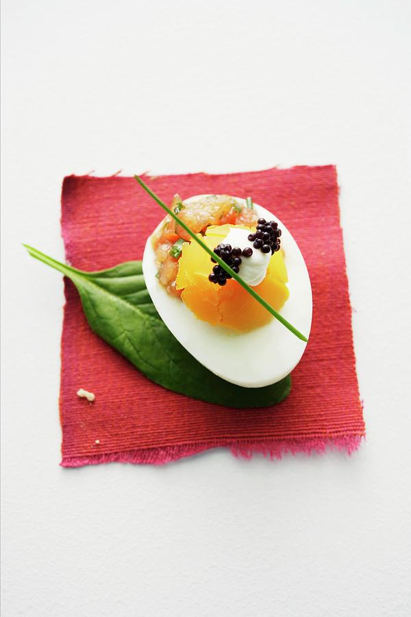 An Egg With Salmon Tartar, Crme Frache And Caviar Photograph by Michael Wissing