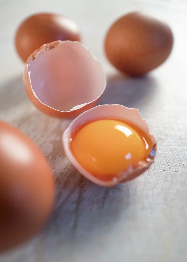 An Egg Yolk In An Eggshell Photograph by Ulrike Koeb