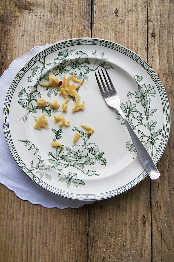Egg Photograph - An Empty Plate With Leftover Sptzle soft Egg Noodles From Swabia by Anne Faber