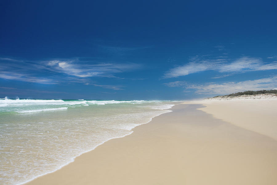 An Empty Sandy Beach On Fraser Island Photograph by Richard Boll