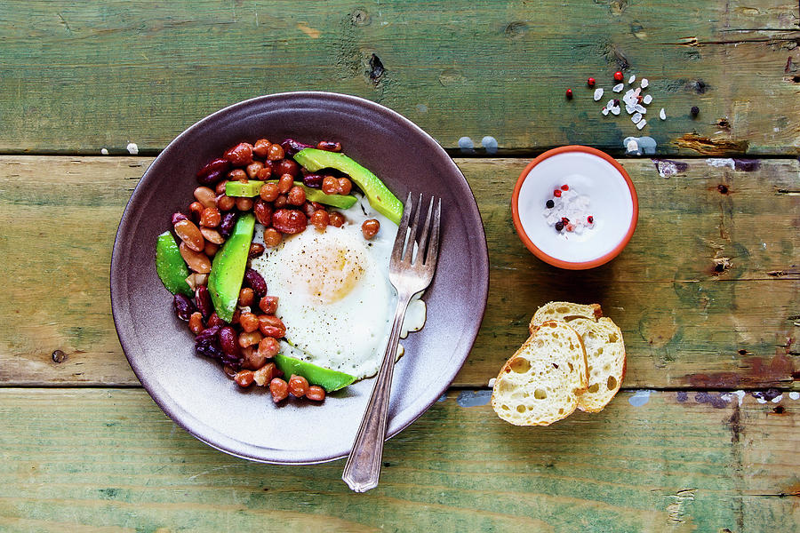 An English Breakfast With Baked Beans, Fried Eggs And Avocado Photograph by Yuliya Gontar