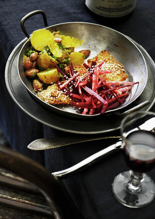 An Escalope With Beetroot And Potato Salad Garnished With Parsley And Almonds Photograph by Mikkel Adsbl