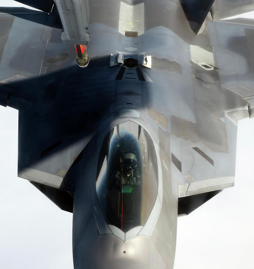 Transportation Photograph - An F-22 Raptor Maneuvers Into Refueling by Stocktrek Images