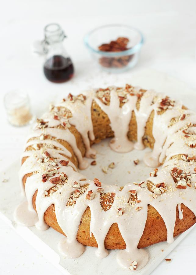 An Iced Ring Shaped Sponge Cake With Nuts And Roasted Coconut ...