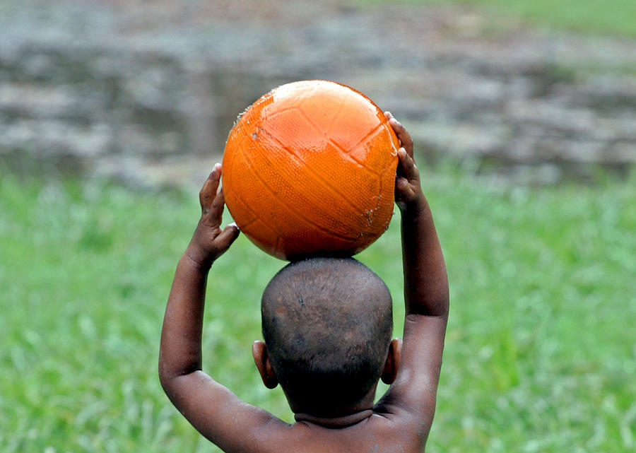 An Indian Child Plays with a Basketball Photograph by Parth Sanyal ...