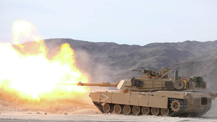 An M1a1 Abrams Tank Fires Its 120mm Photograph by Stocktrek Images