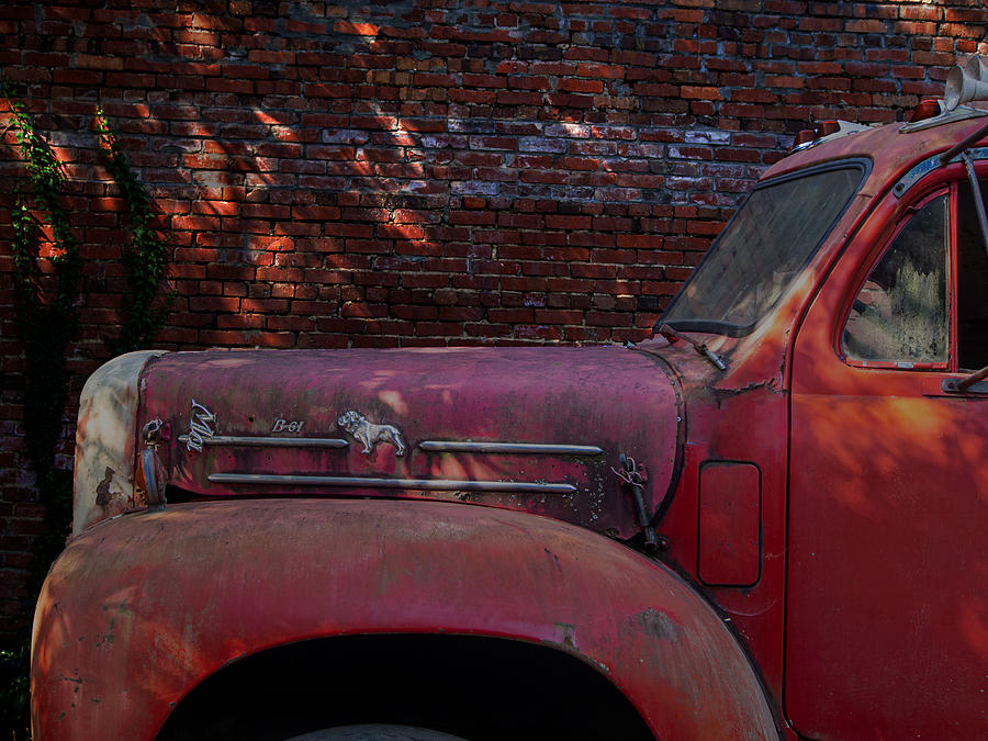 An Old Red Mack Truck Up Against a Brick Wall in Black Mountain, North Carolina Photograph by L Bosco