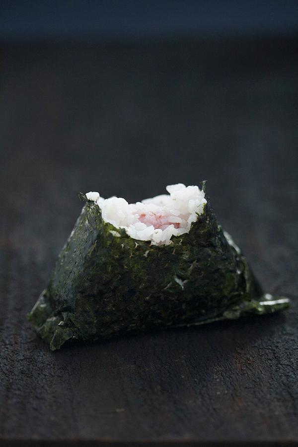 An Onigiri Sushi With A Bite Taken Out Photograph by Martina Schindler ...