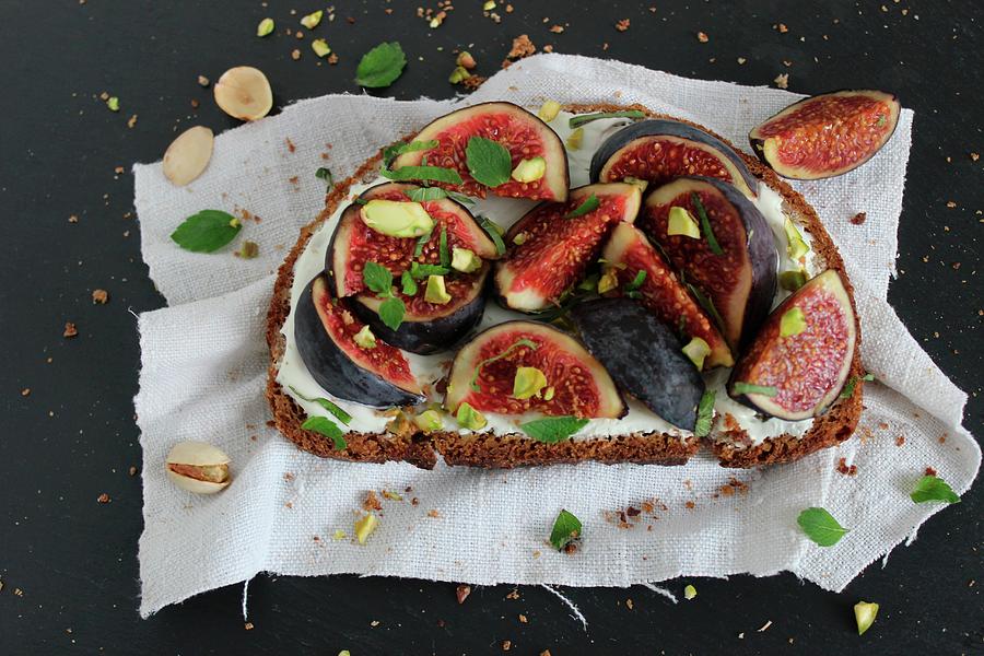 An Open Sandwich With Figs And Pistachios Photograph by Esspirationen