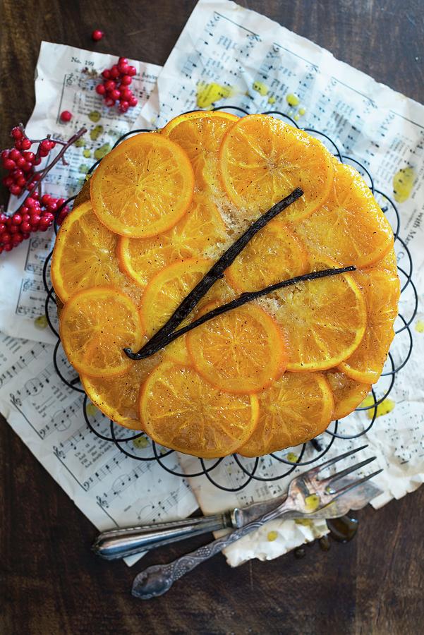 An Orange Cake On A Wire Cooling Rack Photograph by Veronika Studer