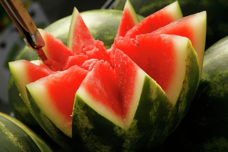 An Organic Water Melon Sliced Into A Star Shape Photograph by Paul Poplis