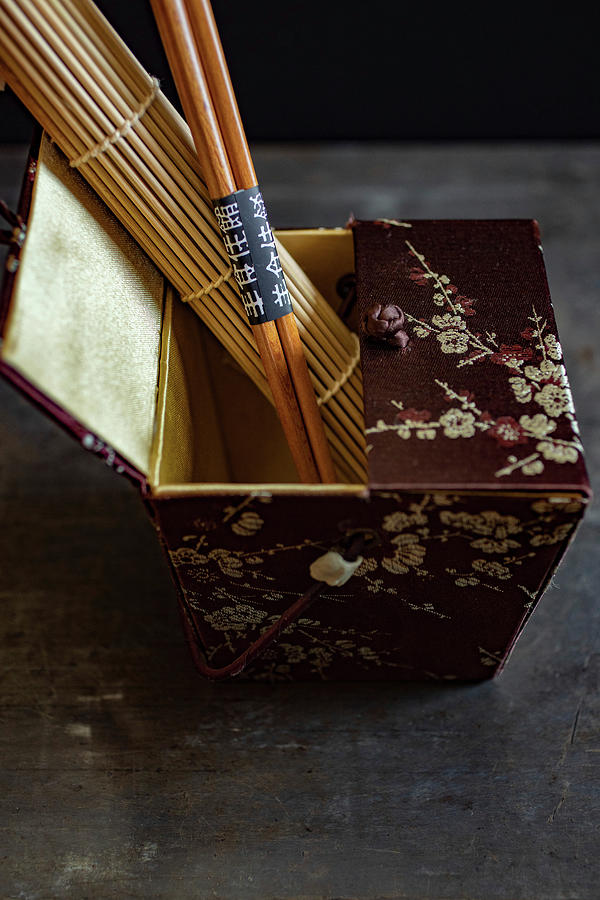 An Oriental Silk Box With A Bamboo Mat And Chopsticks Photograph by Eising Studio