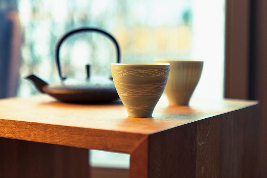 An Oriental Teapot And Two Tea Bowls Photograph by Anneliese Kompatscher