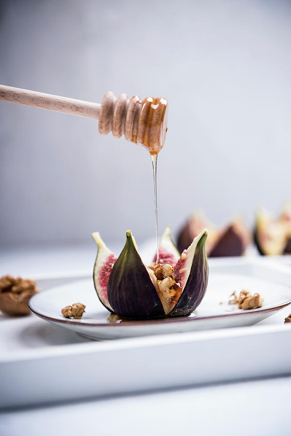 An Oven-baked Fig Filled With Walnuts And Almond Cheese Being Drizzled With Syrup vegan Photograph by Kati Neudert