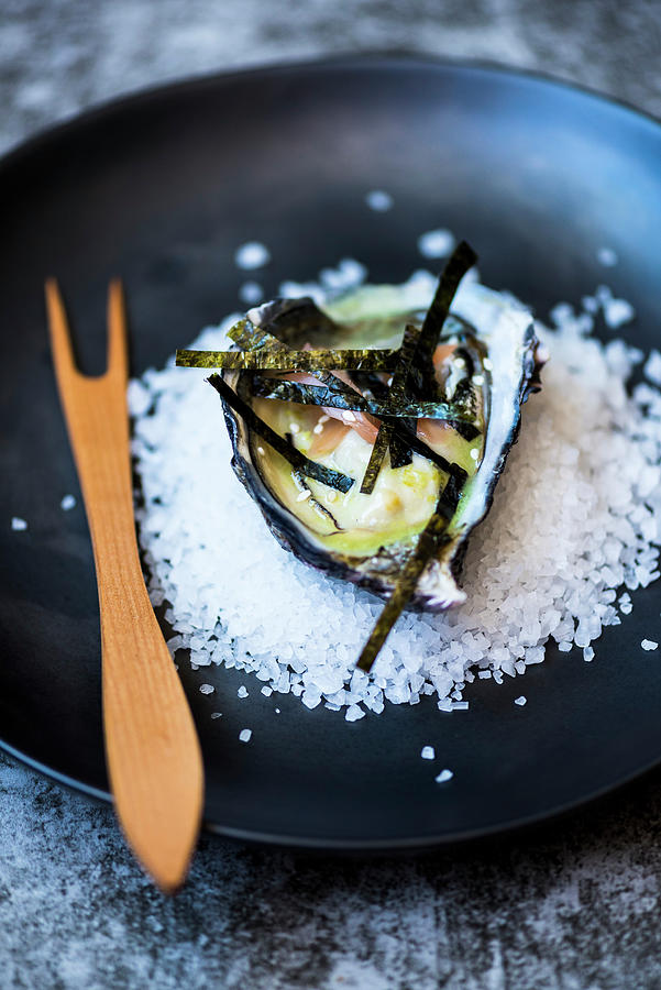 An Oyster With Algae Strips On A Bed Of Salt Photograph by Hein Van Tonder